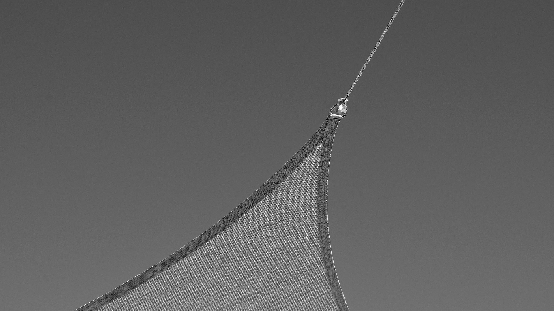 Sailing yacht underway at sunset, the kind of charter boat where packing choices matter most